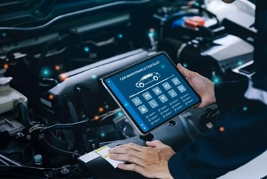 a man holding a tablet with all the specs of a car